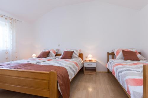 מיטה או מיטות בחדר ב-Apartman Ivona