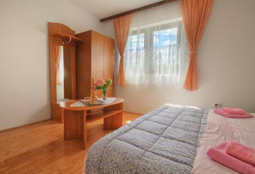 Postel nebo postele na pokoji v ubytování Apartman Josipa