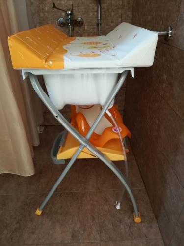 a sink in a bathroom with a book on it at Nikoloudi Estate in Agios Nikolaos
