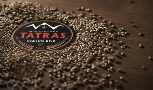 a pile of grains of coffee on a table at Penzión Minipivovar Tatras in Poprad