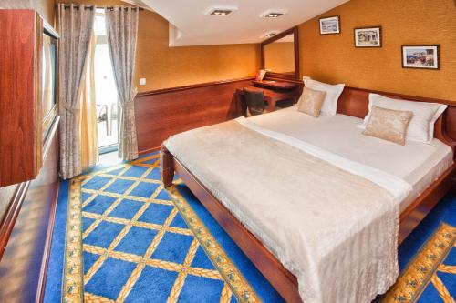 a bedroom with a large bed in a room at Luxury Sea Residence by Kristina in Tivat