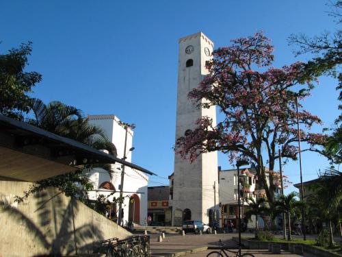 a clock tower in the middle of a city at Hotel El Triangulo in Pitalito