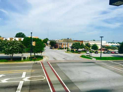 an intersection of an empty street in a town at Inn on the Square, an Ascend Collection Hotel in Greenwood