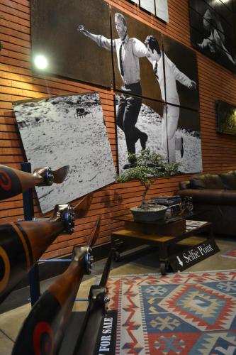 a room with a wall with a picture of a man at Alfonsina Hotel Boutique in Santa Cruz de la Sierra