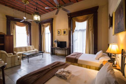 Postel nebo postele na pokoji v ubytování El Gran Hotel