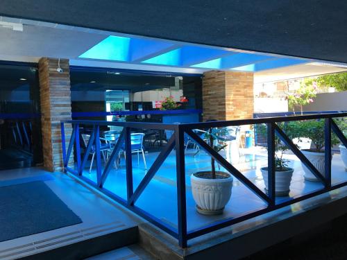 a view of a house from a balcony with blue lights at Studio Everest Flats in Recife