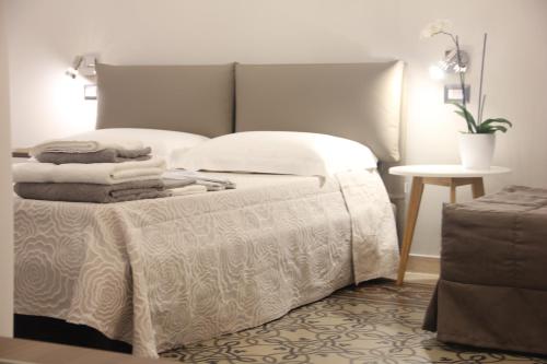 Postel nebo postele na pokoji v ubytování Matera Guest House