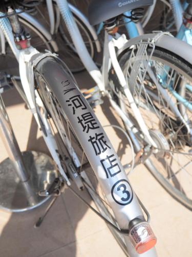 a bike with a sign on the front wheel at The Riverside Hotel Hengchun in Hengchun