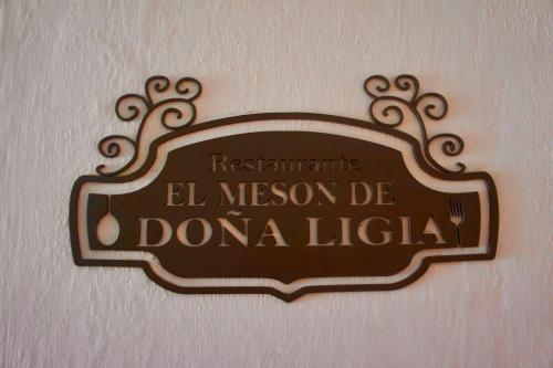 a sign on a wall that readsremacist el meson de domano l at Hotel El Aerolito in Santa Rosa de Viterbo