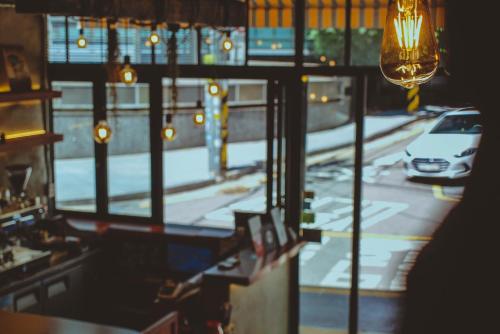 a view of a street from a window with a car at Hotel MIDO Myeongdong in Seoul