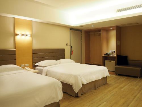 Ένα ή περισσότερα κρεβάτια σε δωμάτιο στο The Riverside Hotel Esthetics