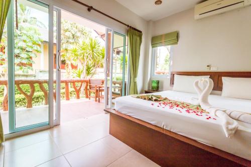 Postel nebo postele na pokoji v ubytování Shangrilah Bungalow