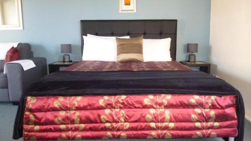 Llit o llits en una habitació de Bella Tuscany Motor Lodge