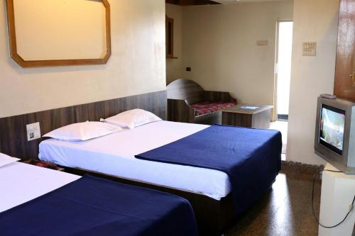Ένα ή περισσότερα κρεβάτια σε δωμάτιο στο Viva Guest House