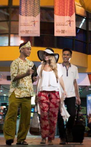 a group of people walking down a mall at Banyan Tree Bintan in Lagoi