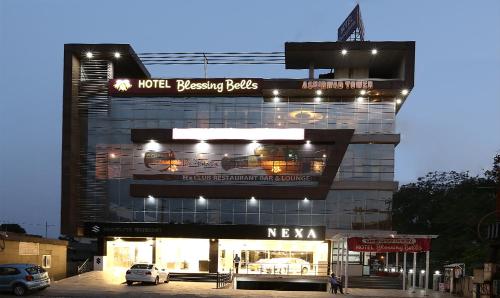 a building with a parking lot in front of it at Treebo Trend Blessing Bells in Dehradun