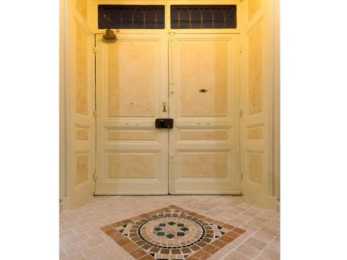 a door in a room with a tile floor at Sanremo Inn in Sanremo