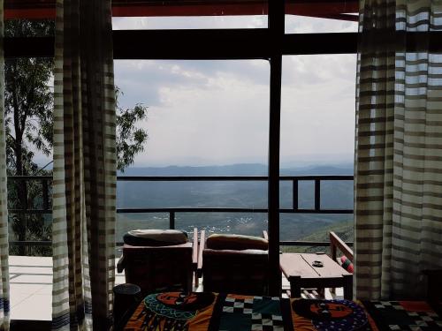 una ventana grande con vistas al océano. en Top Twelve Hotel - Lalibela, en Lalibela