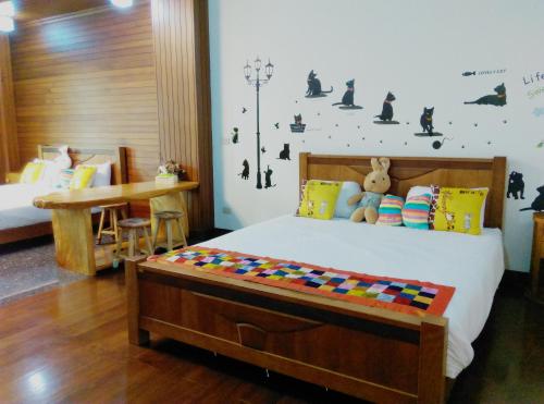 Postel nebo postele na pokoji v ubytování Tainan Yi Home