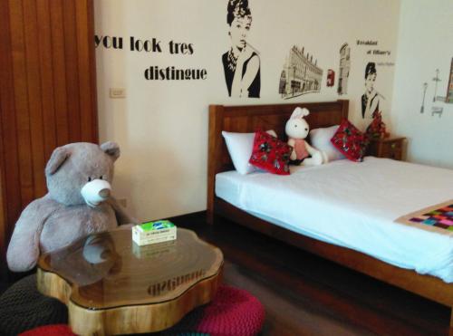 Postel nebo postele na pokoji v ubytování Tainan Yi Home