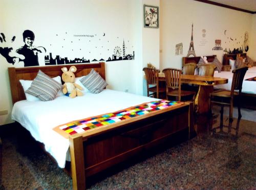 Postel nebo postele na pokoji v ubytování Tainan Yi Home