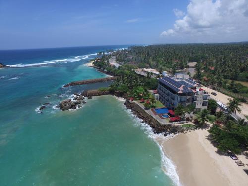 an aerial view of a resort on a beach at Garton's Cape in Ahangama