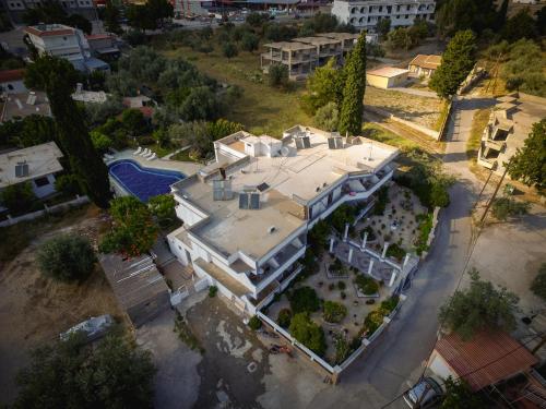 an aerial view of a large house with a yard at Hotel Dimitra Sun in Archangelos