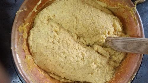 a bowl of cornbread with a spatula in it at Agriturismo al Marter in Ledro
