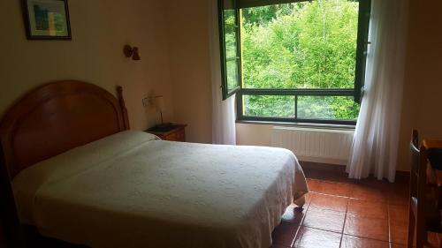 Cama o camas de una habitación en Hotel Benzua