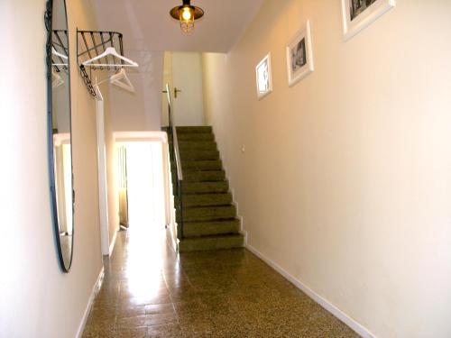 a hallway with a staircase and a stair case at Holiday Home Lija Center in Rab