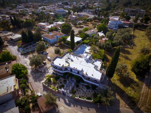 an aerial view of a large house in a city at Hotel Dimitra Sun in Archangelos
