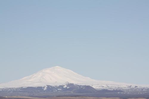a mountain with snow on top of it at Uxahryggur in Hvolsvöllur