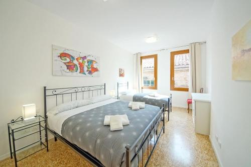 a bedroom with two beds and a sink at DolceVita Apartments N 372 in Venice