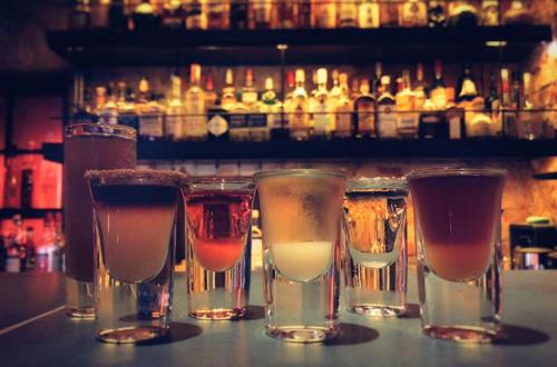 a group of four different drinks in glasses on a bar at GOIN Old House & Bar in Tainan