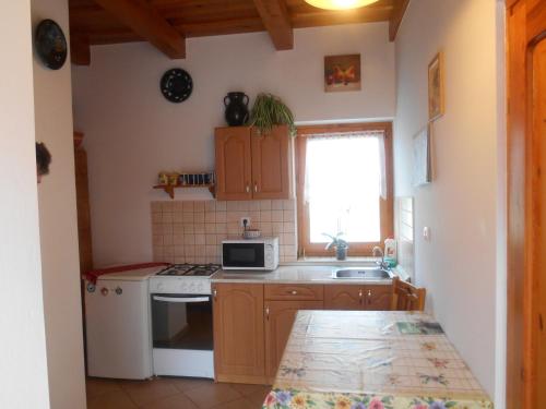 A kitchen or kitchenette at Vendégmarasztaló Porta