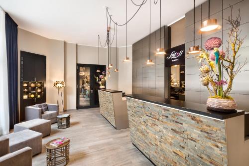 a lobby of a store with a counter and chairs at Lux 11 Berlin-Mitte in Berlin