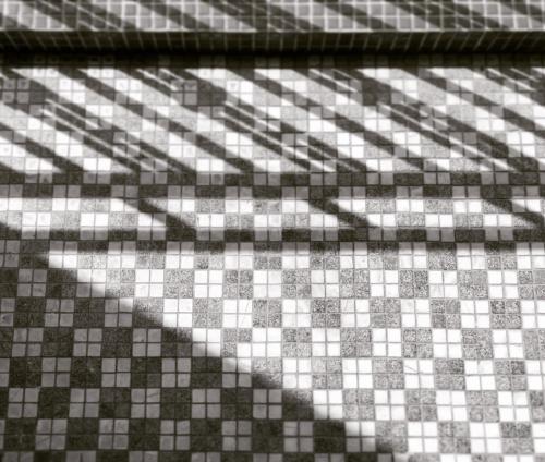 a black and white checkered floor in a bathroom at GOIN Old House & Bar in Tainan