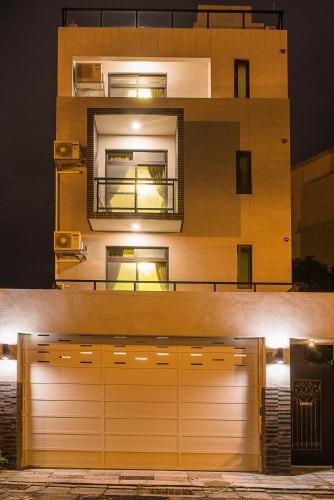 a building with a garage door in front of it at Warm Breeze Stay in Hualien City