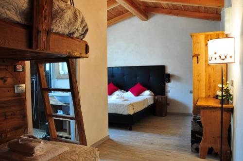 a bedroom with a bunk bed in a room at Serendipity Hotel in Sauze dʼOulx
