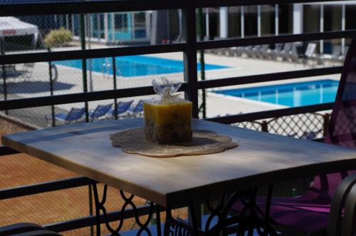 a table with a cake on top of a balcony at Apartament Żarko in Pogorzelica