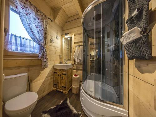 a bathroom with a toilet and a shower and a sink at Domki nad Białką in Czarna Góra