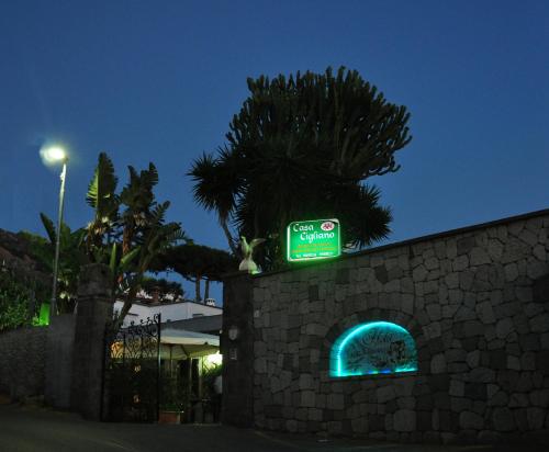 a sign that is on top of a wall at Casa Cigliano in Ischia