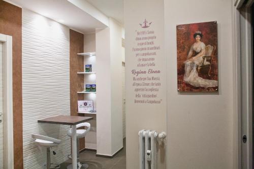 a wall with a picture of a woman on it at B&B Regina ELENA in Campobasso
