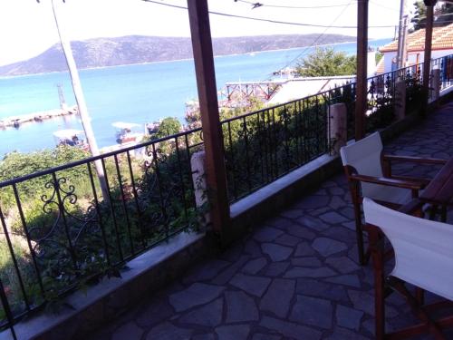a balcony with a view of the water at Thea Studios in Kalamakia