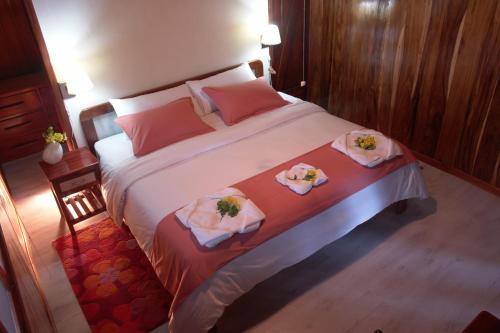 Кровать или кровати в номере The Wooden House Hotel