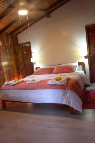 Кровать или кровати в номере The Wooden House Hotel