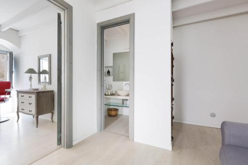 a living room with a sliding door leading to a bedroom at Appartamento Al Bastione by BarbarHouse in Otranto