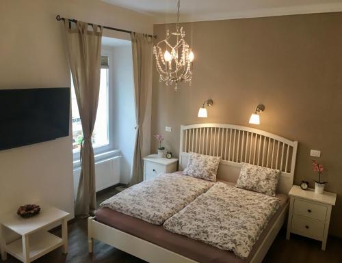 Кровать или кровати в номере Julija & Filip Apartments