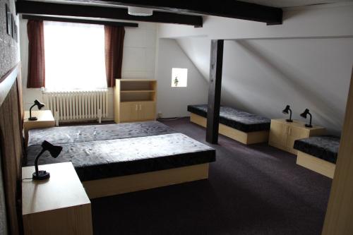 a room with two beds and a window at Horský dům Veronika in Cerny Dul