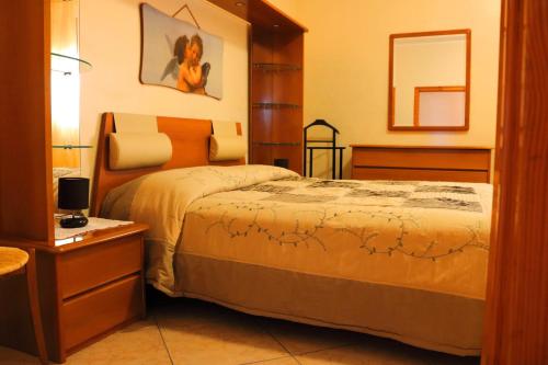 Postel nebo postele na pokoji v ubytování Villa Santo Stefano